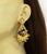 The Multicolor Enamel Peacock 22k Gold Chandelier Earrings are a stunning piece of vintage jewelry that features a unique...