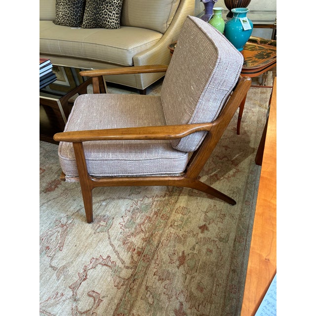 Classic Danish midcentury modern sculpted armchair / club chair attributed to Ib Kofod-Larsen having sleek silhouette,...