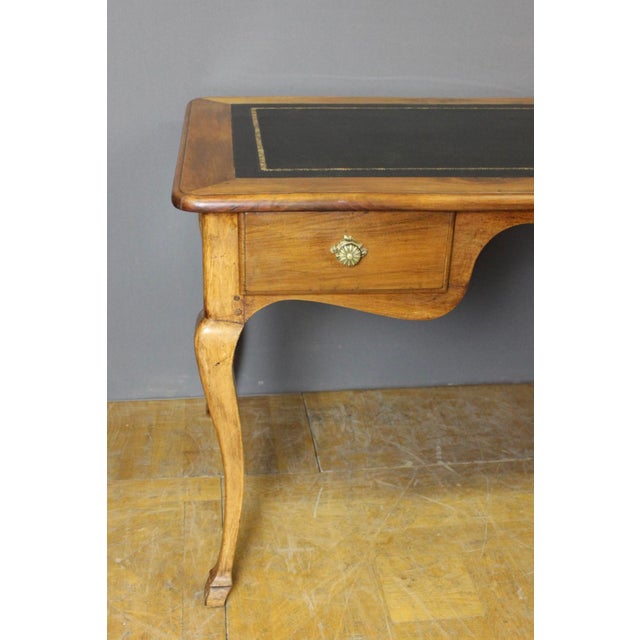 Large Louis XV style walnut desk, opening with two drawers, center desk, black leather top, 19th century, in very good...