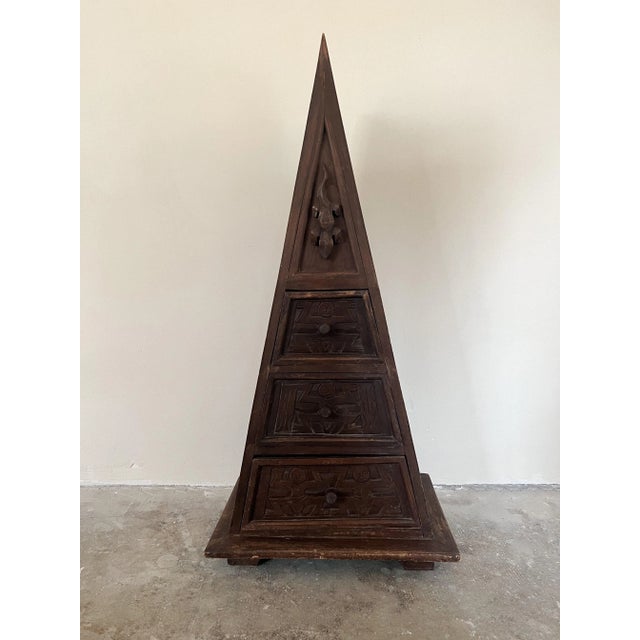 Triangular mahogany chest of drawers with 3 drawers and hand carved wooden pulls.