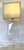 Stylish vintage lucite table lamp from the 1970's. The flat body has a faceted edge and starburst center etching and sits...