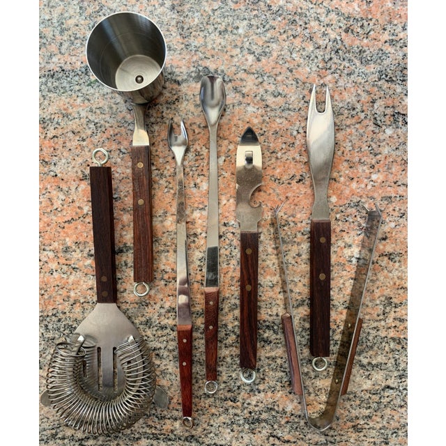 Seven piece Japanese modern cocktail bar tool set crafted in rosewood and stainless steel, circa 1960s Japan. Set...