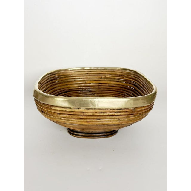 Elegant French fruit basket handcrafted from woven wicker and accented with polished brass trim. Its gently rounded...