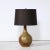 This sophisticated Mid Century Modern table lamp was realized in France circa 1960. It features a tear drop form with a...