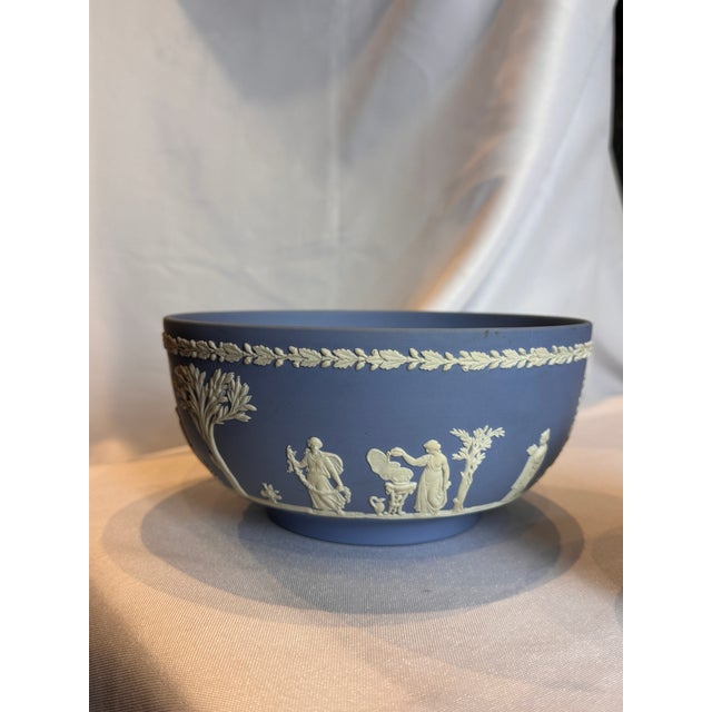 A beautiful serving bowl from the vintage "Sacrifice" pattern of Wedgwood Jasperware in the iconic pale blue and white...