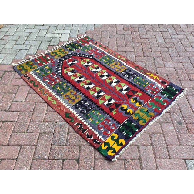 Beautiful, vintage, handwoven kilim is approximately 60 years old. It is handmade of very fine quality, hand-spun wool in...