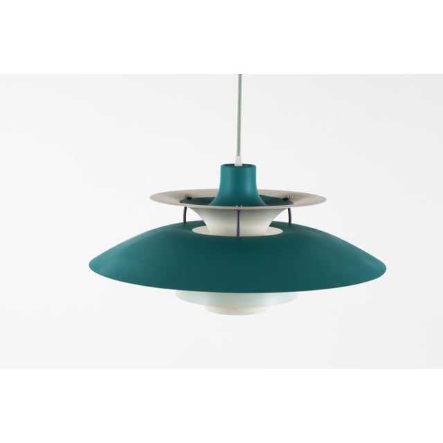 This iconic Danish 1960's hard to find blue-toned ceiling pendant light was designed by Poul Henningsen for Louis Poulsen....