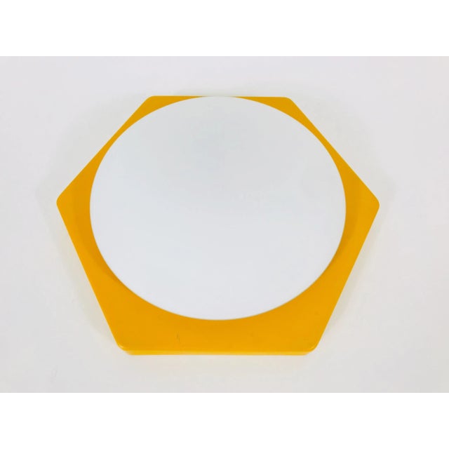 An exceptional midcentury wall lamp in the style of Rolf Krüger. The lamp is from the 1970s and made in Germany. The body...