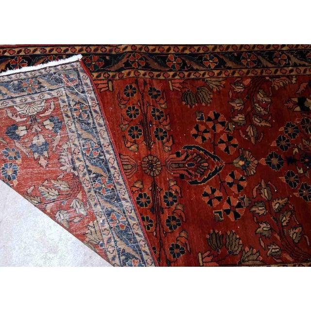 Handmade antique Persian Sarouk Mahajeran rug in original good condition. The rug is from the beginning of 20th century...