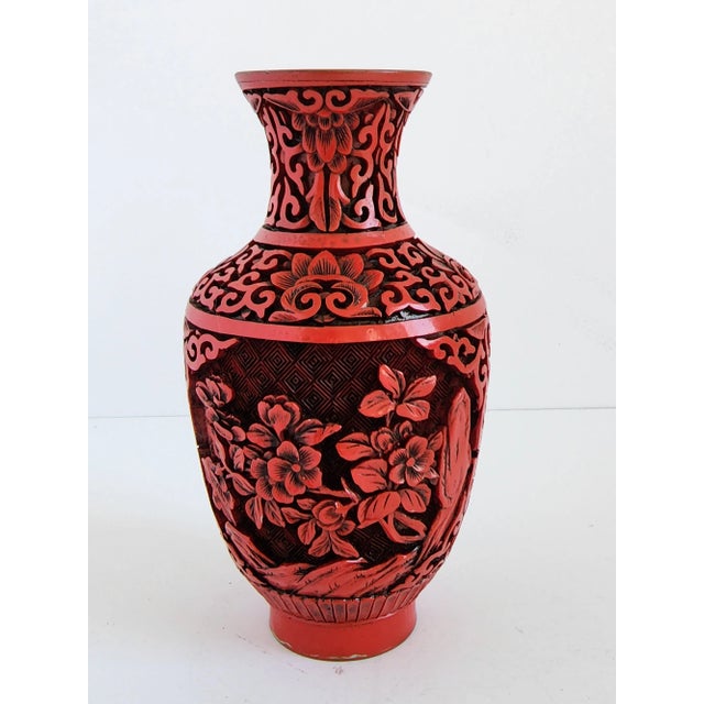 Vintage small Chinese Cinnabar vase with carved lacquered surface and brass lining. Beautiful floral carving throughout,...