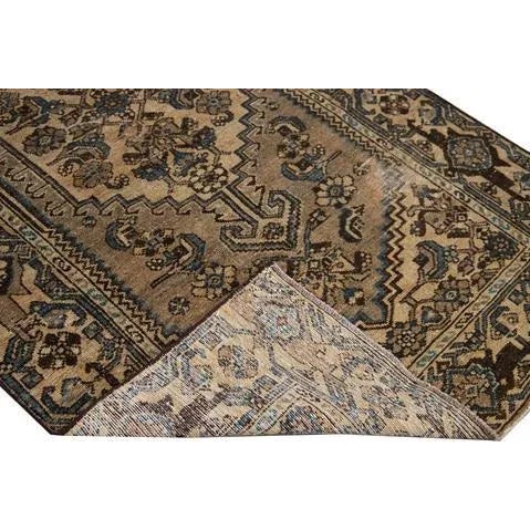 Beautiful Vintage Geometric hand-knotted wool rug with a brown field. This rug has beige accents all-over a geometric...