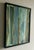 This is a collage made from pieces of oil paintings and assembled into a new ready to hang frame. The color is difficult...