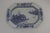 Chinese export blue and white platter. Rural scene with floral border. Measures 15" by 11". Old staple repair on cracks.