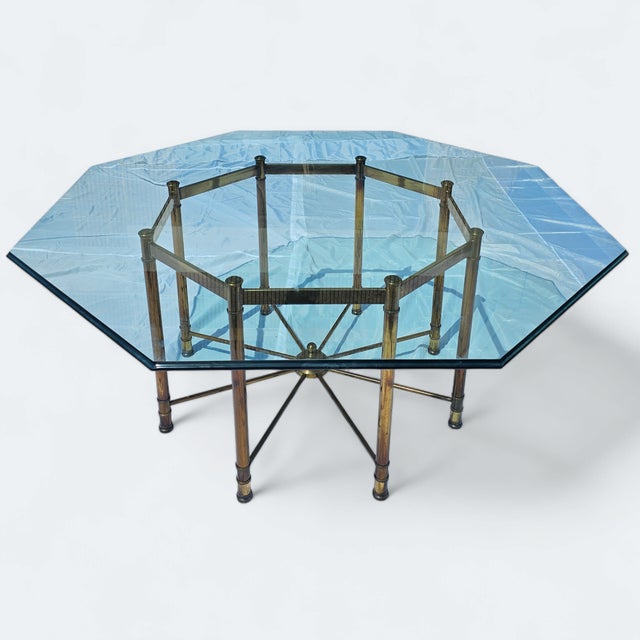 The Hollywood Regency Mastercraft attributed 73" Brass [Plated] and Glass Octagonal Dining Room Table perfectly combines...