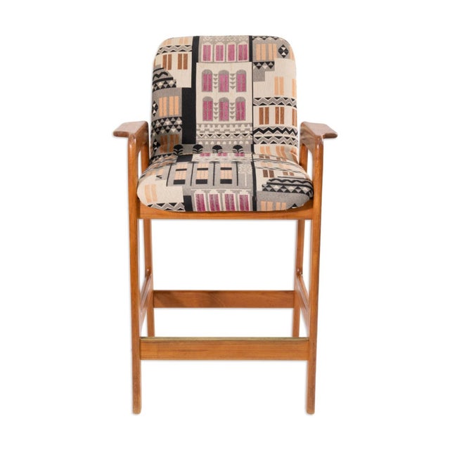 This set of four barstools by Benny Linden embodies timeless mid-century craftsmanship and comfort. Each stool features a...