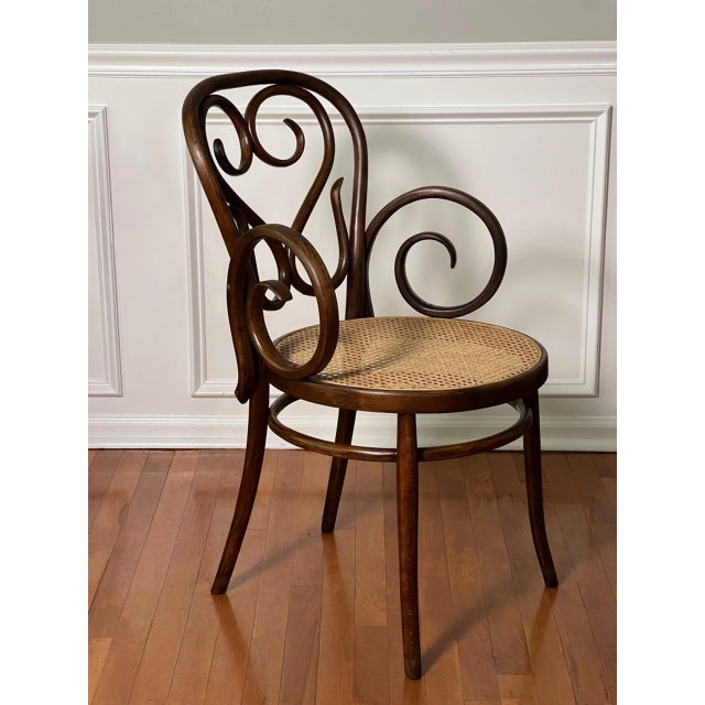 Midcentury bentwood armchair with cane seat by the renowned workshop of Salvatore Leone, Italy, 1960s. This piece is a...