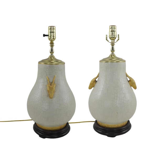 This pair of exquisite table lamps feature an attractive crackle finish as a decorative element, and the crackled texture...