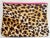Nylon leopard print on the outside, a neutral-colored leather lining, bright pink zipper and trim, with a silver-colored...