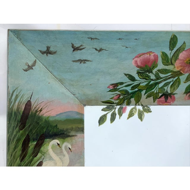 Early 1900s hand painted mirror with lily pads, swans, pastoral scene and florals. Painting continues onto the mirror...