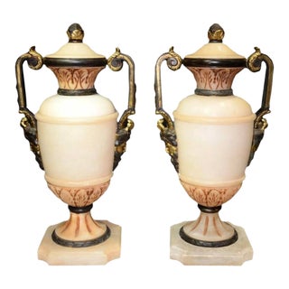 19th Century Neoclassical Pair of Carved Alabaster and Bronze Urns With Mask Face Handles For Sale