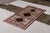 Hand-knotted in wool originating circa 1920-1930, this antique Persian rug connotes a tribal Gabbeh rug design marrying a...