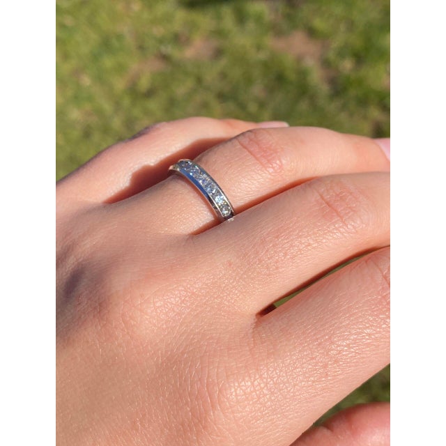 The Asolo: Channel Set Natural Diamond Band in White Gold. This stunning band showcases a series of round brilliant cut...