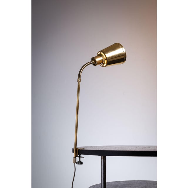 This Swedish design table clamp lamp by BJS Skellefteå is a stunning example of minimalist, functional lighting. Crafted...