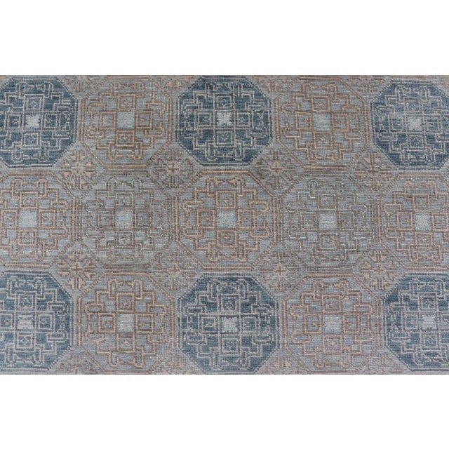 Modern Hand Knotted Khotan in Wool With All-Over Medallion Design in Blue and Earthy Tones For Sale - Image 10 of 13