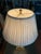 A Haig table lamp featuring a fluted crystal column supported by a stepped base with brass accents. The elegant column...