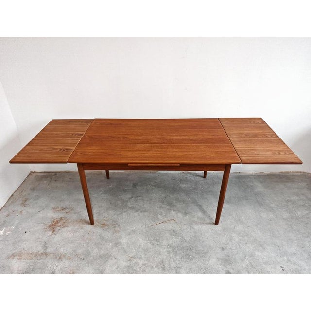 In this listing you will find a classic of Mid Century Modern era, an extendable dining table done in teak. The table has...