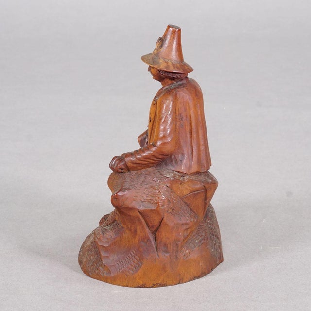 Antique Hand-Carved Tyrolean Farmer Sculpture, ca. 1880 This finely carved wooden figure depicts a traditional Tyrolean...