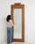 This piece presents as a mirror, distinguished by natural pine, vertical plank. It was made in France during 1900s, a...