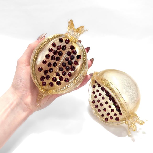 A fine pair of Murano glass fruit figures. Designed by Romeo Gigli for Pauly & Co. In the form of a pomegranate. The body,...