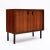 Cabinet from mid-century Denmark made of solid wood construction; primarily rosewood. This piece has four metal legs in a...