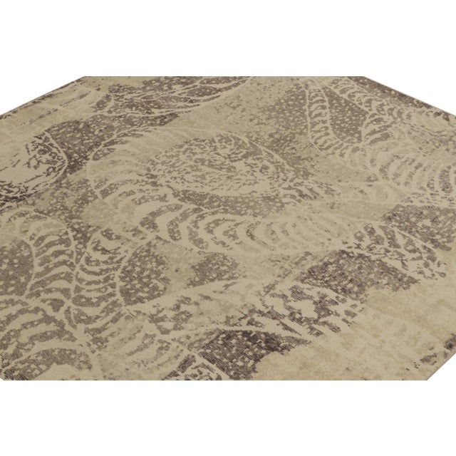 From Rug & Kilim’s Homage collection, a square distressed style abstract rug relishing a forgiving play of beige-brown and...