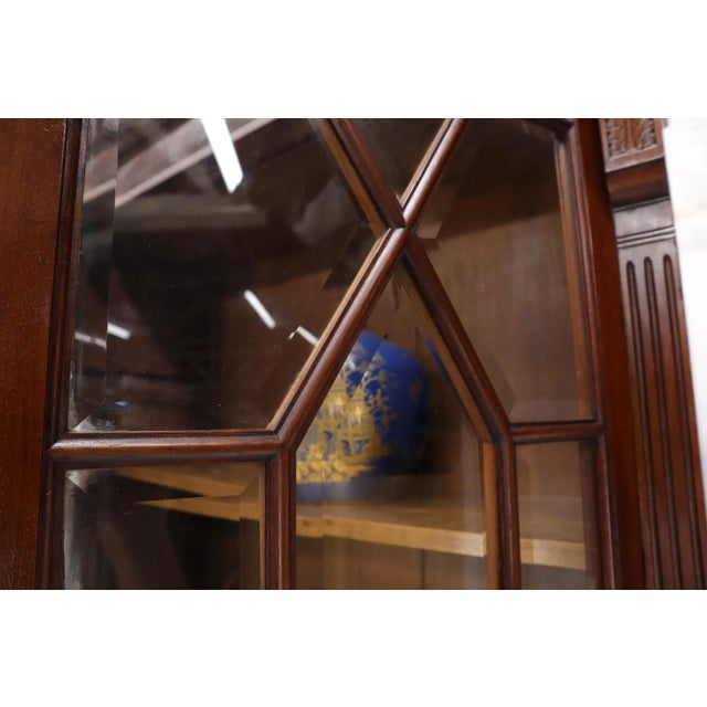Turn of the century mahogany Georgian two part secretary leather top desk writing table with individual beveled glass panes.
