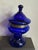 A striking cobalt blown glass decanter/flower frog with original pierced metal lid, showcasing the bold color and...