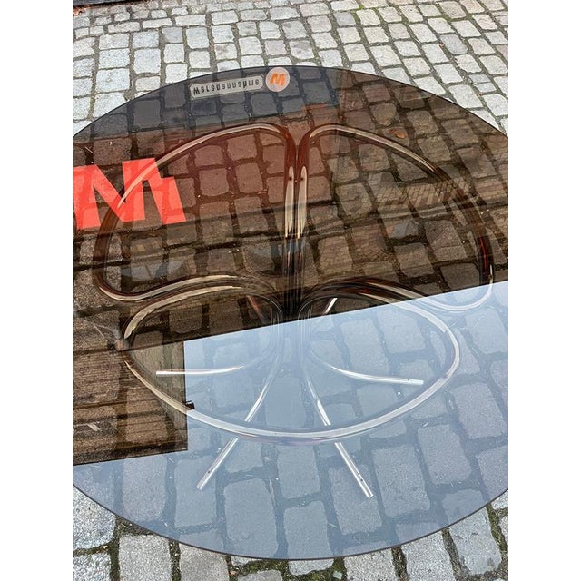 This round dining table is a stylish and versatile design piece, created by the Italian designer Gastone Rinaldi in the...