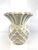 A charming vintage ceramic vase modeled in the form of a pineapple, finished in a soft creamy white glaze with subtle...
