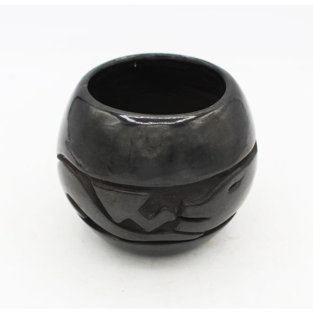 Circa 1980s-90s Howard Naranjo blackware pottery low vase or bowl. Member of the renowned Naranjo Family of potters of...
