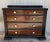 About Beautiful burl walnut drawers with original bronze pulls. Cabinet is set on ebonized trestle foot and so the side...
