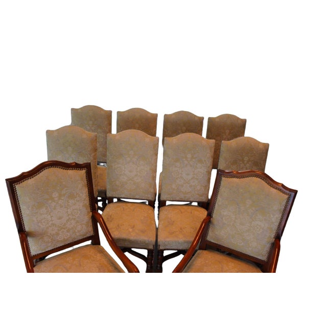 A distinguished set of ten Vintage Provence Collection Louis XIV style dining chairs, crafted in 2003 and designed with...