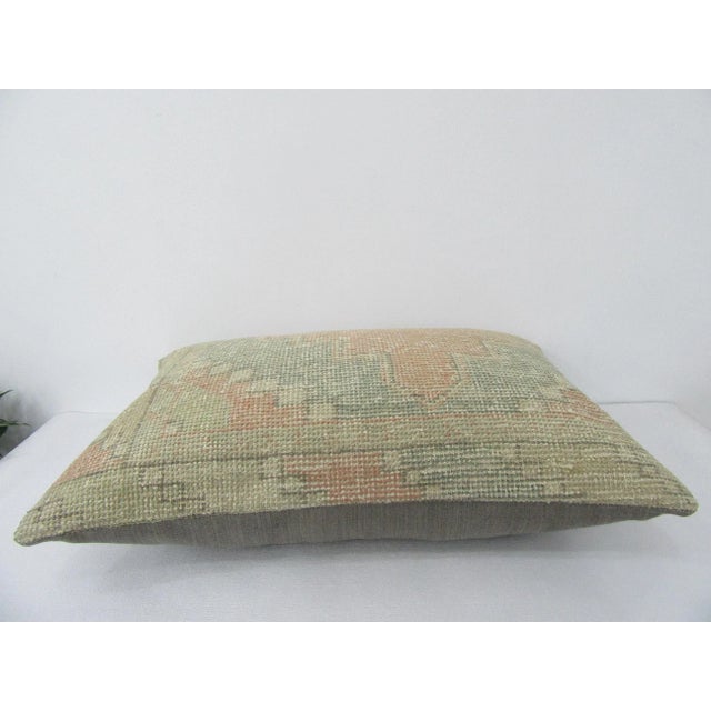 Decorative pillow cover made from a vintage Turkish handknotted rug. Backed with good quality cotton fabric. Pillow...