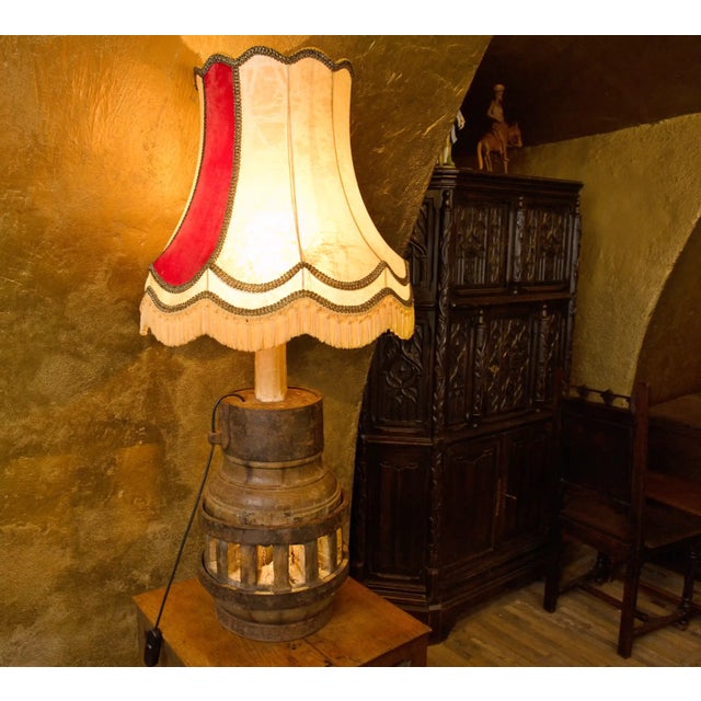 Original antique lamp made from a solid wooden hub of an old rickshaw wheel, probably from a farm wagon or cart. The body...