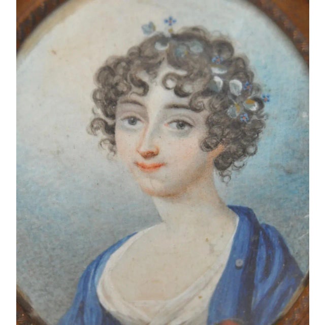 19th c. Portrait Miniature Young Woman with Flowers in Her Hair This charming young woman has a collection of fresh picked...