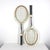 Pair of Vintage wooden tennis racquets for designer decorating. These are wood with leather grips. These have great patina...