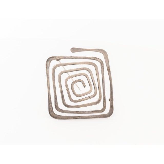 Ed Wiener (American, 1918-1991) Geometric Spiral Form Sterling Silver Brooch, signed and marked "Ed Wiener / Sterling" to...