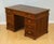 The Antique Rare Victoria Regina Military Campaign Pedestal Desk, circa 1880, is a truly exceptional piece of furniture...