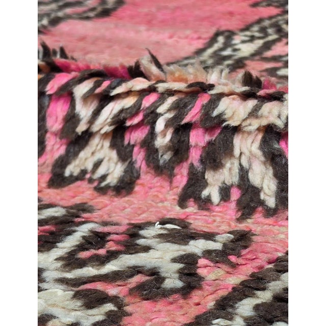 Vintage Moroccan Tribal Rug | Handwoven Berber Wool Rug with Pink Field and Star Medallions This bold vintage tribal rug...