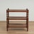 Handsome vintage British colonial style stand crafted in mahogany with three caned tiers on classic turned supports.